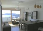Atemberaubende 98 m2 große Wohnung in Bečići mit drei Schlafzimmern und Meer-und Bergblick